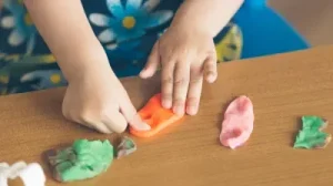 small child playing with playdough for Play Therapy in Mount Barker
